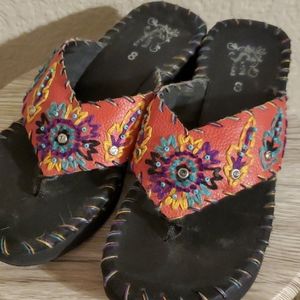 Sassy Sista's flip flops and bracelet.